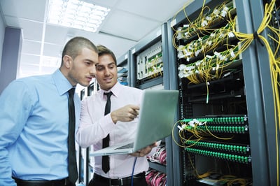 group of young business people it engineer in network server room solving problems and give help and support